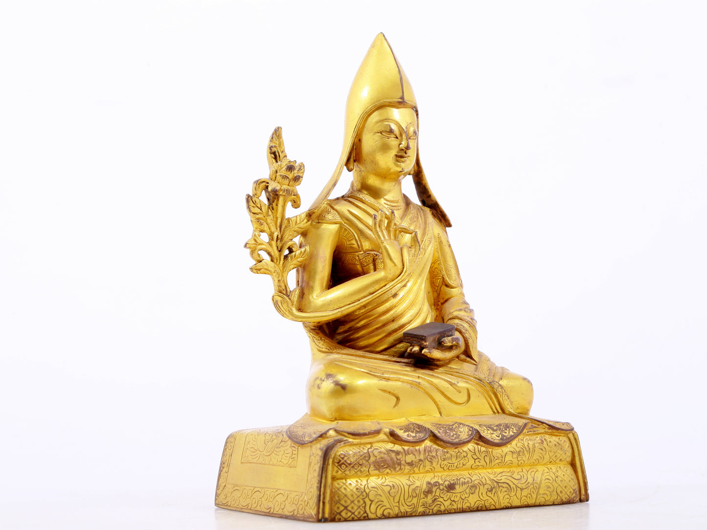 A serene gilt bronze statue of Tsongkhapa