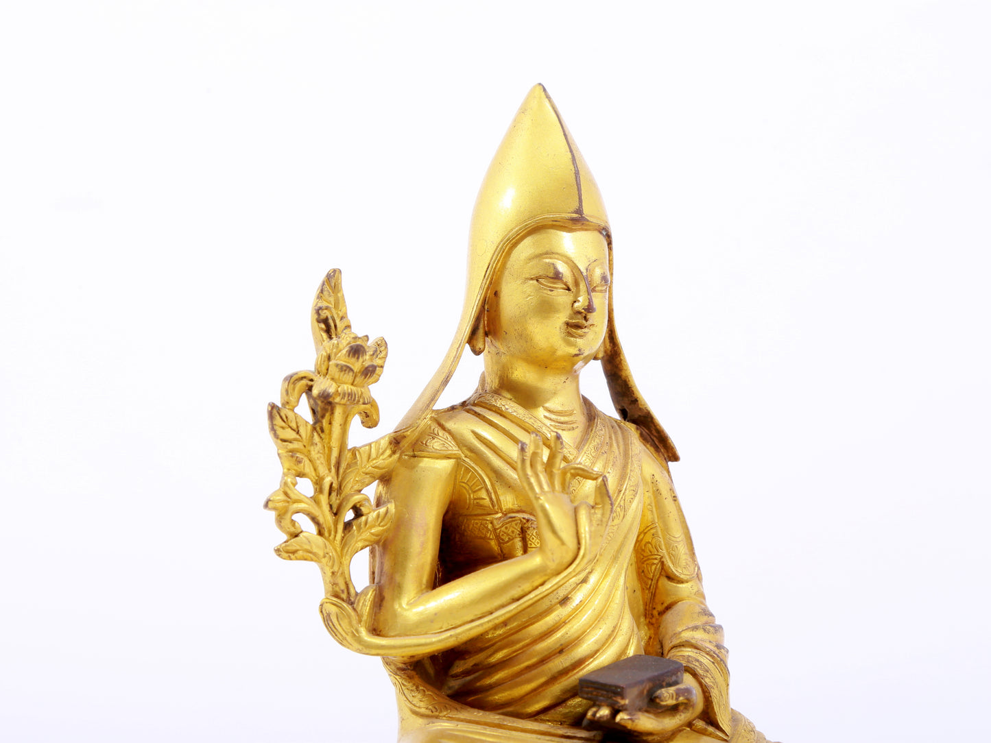 A serene gilt bronze statue of Tsongkhapa