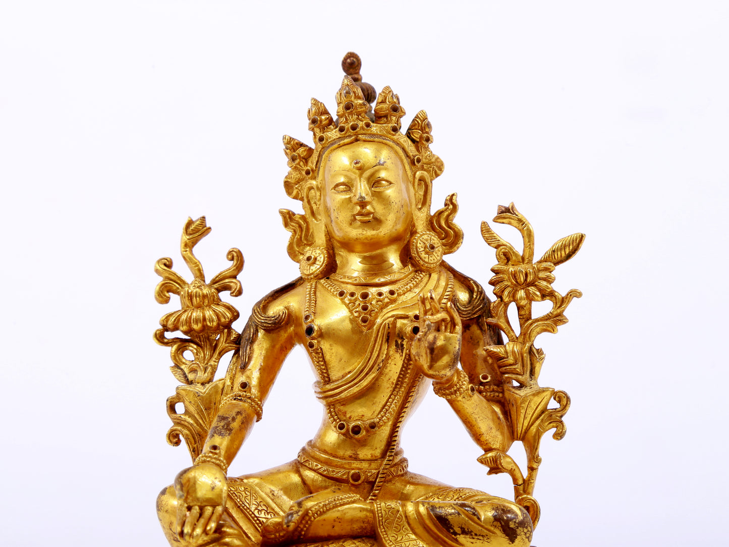 A serene gilt bronze green Tara statue