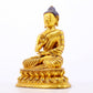 A serene gilt bronze statue of Gautama Buddha