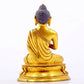 A serene gilt bronze statue of Gautama Buddha