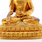 A serene gilt bronze statue of Gautama Buddha