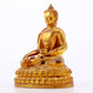 A serene gilt bronze statue of Gautama Buddha