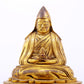 A serene gilt bronze statue of Tsongkhapa