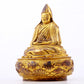 A serene gilt bronze statue of Tsongkhapa