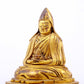 A serene gilt bronze statue of Tsongkhapa