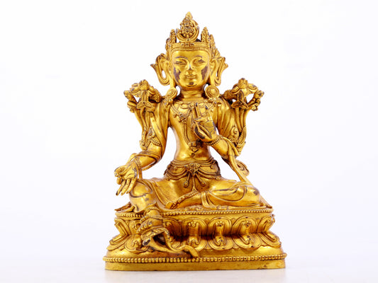 A serene gilt bronze green Tara statue