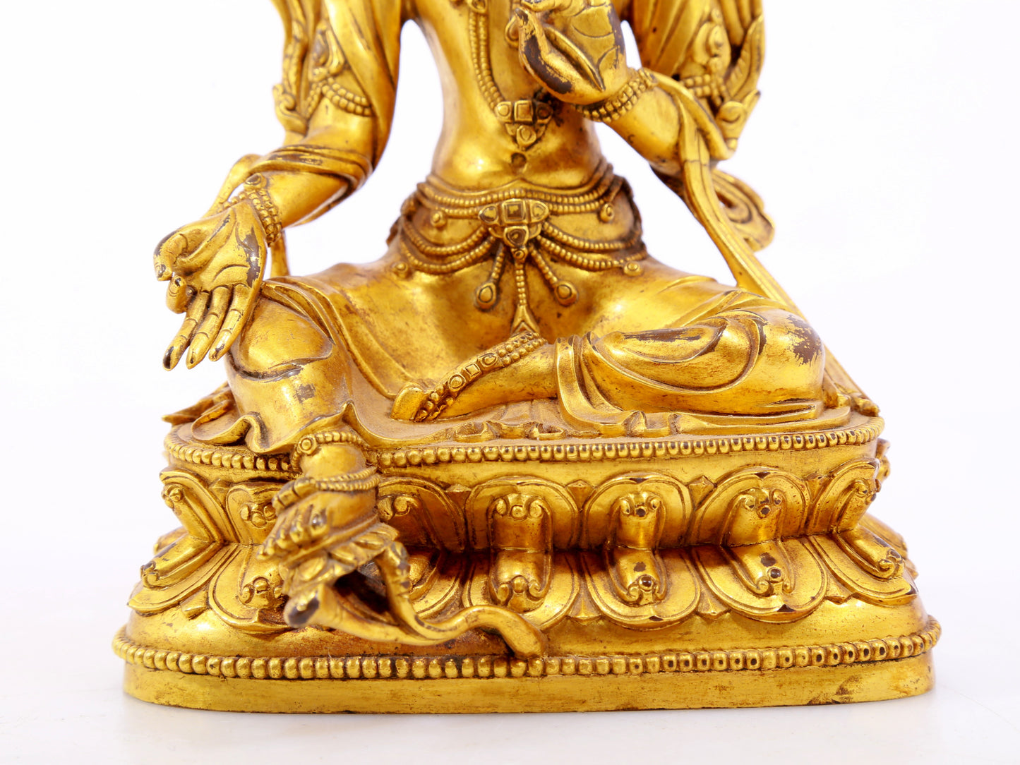 A serene gilt bronze green Tara statue