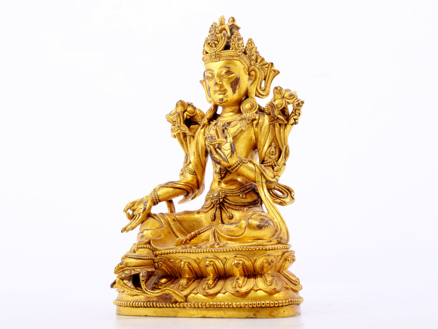 A serene gilt bronze green Tara statue