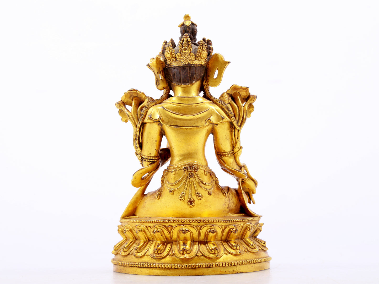 A serene gilt bronze green Tara statue