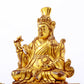 A serene gilt bronze statue of the Guru