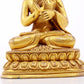 A serene gilt bronze statue of Gautama Buddha