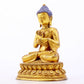 A serene gilt bronze statue of Gautama Buddha