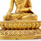 A serene gilt bronze statue of Gautama Buddha