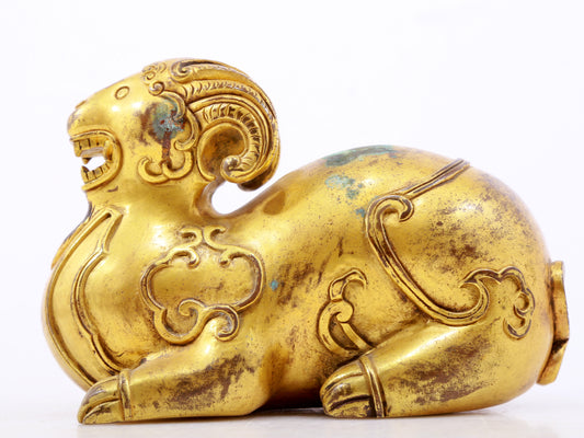 A serene gilt bronze auspicious animal ornaments