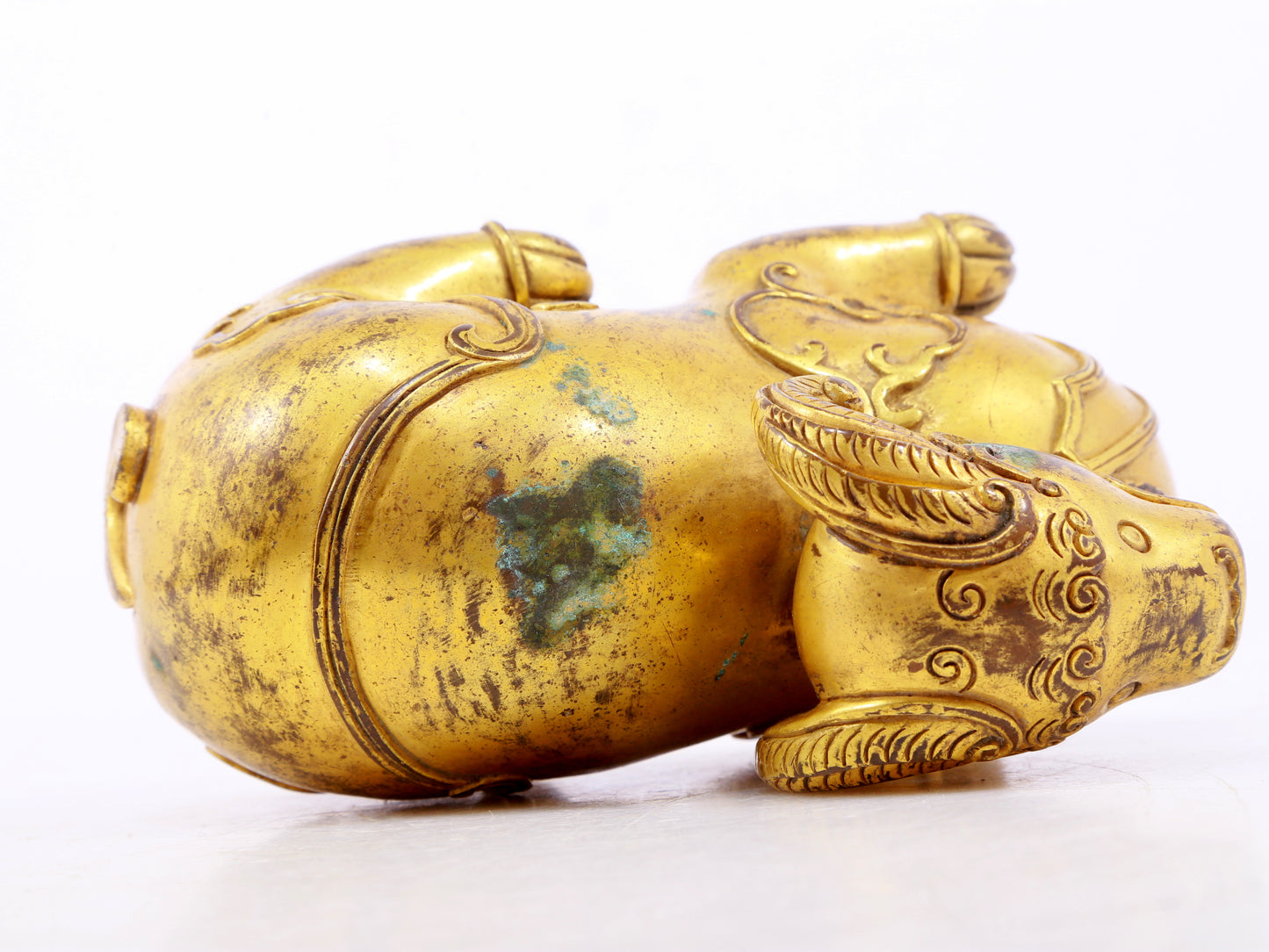 A serene gilt bronze auspicious animal ornaments