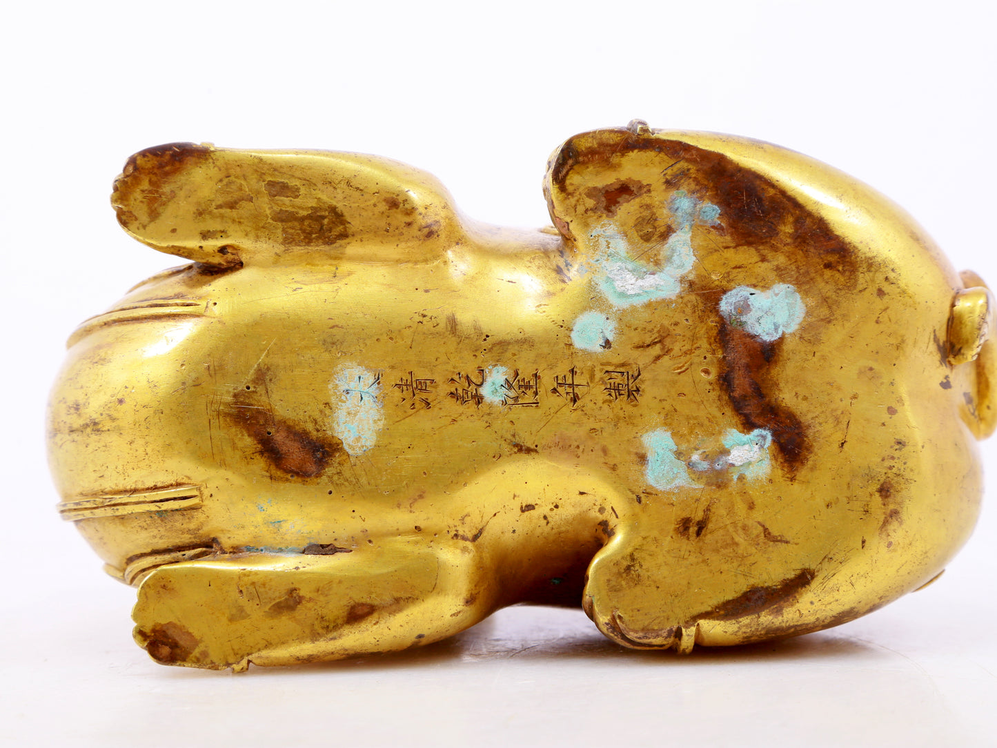 A serene gilt bronze auspicious animal ornaments