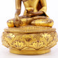 A serene gilt bronze statue of Gautama Buddha