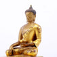 A serene gilt bronze statue of Gautama Buddha