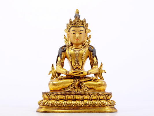 A serene gilt bronze statue of Amitayus Buddha