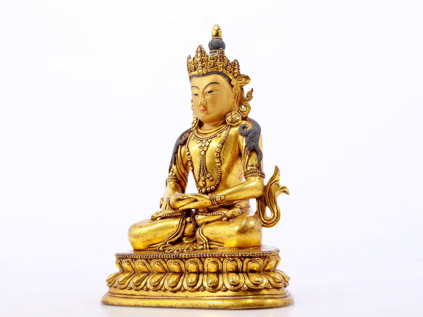 A serene gilt bronze statue of Amitayus Buddha