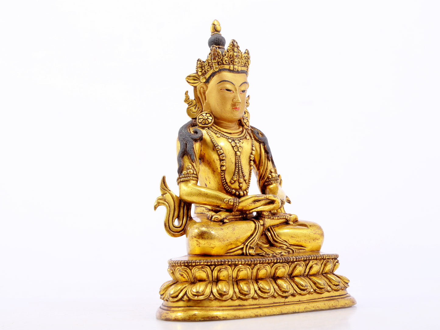 A serene gilt bronze statue of Amitayus Buddha