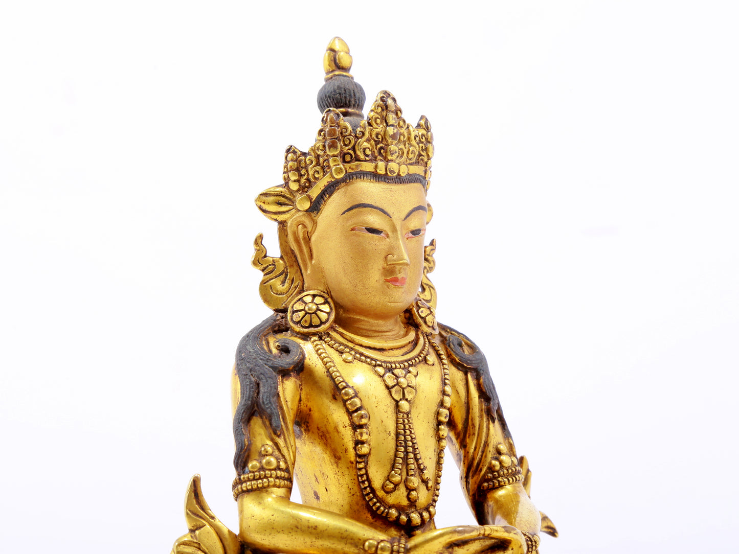 A serene gilt bronze statue of Amitayus Buddha