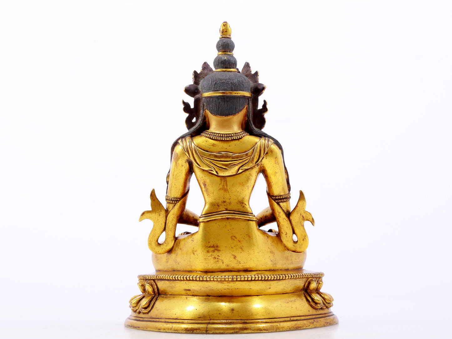 A serene gilt bronze statue of Amitayus Buddha