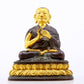 A serene gilt bronze statue of the master