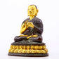 A serene gilt bronze statue of the master