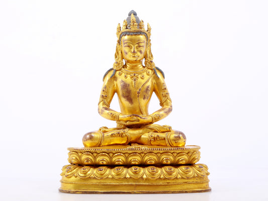 A serene gilt bronze statue of Amitayus Buddha