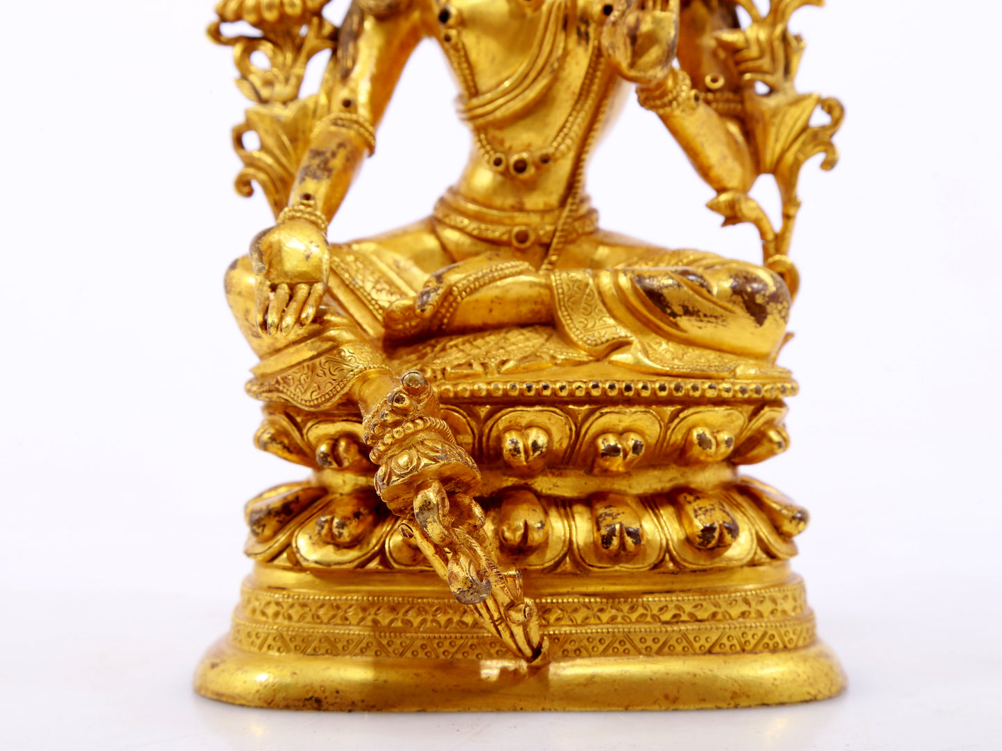 A serene gilt bronze green Tara statue