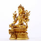 A serene gilt bronze green Tara statue