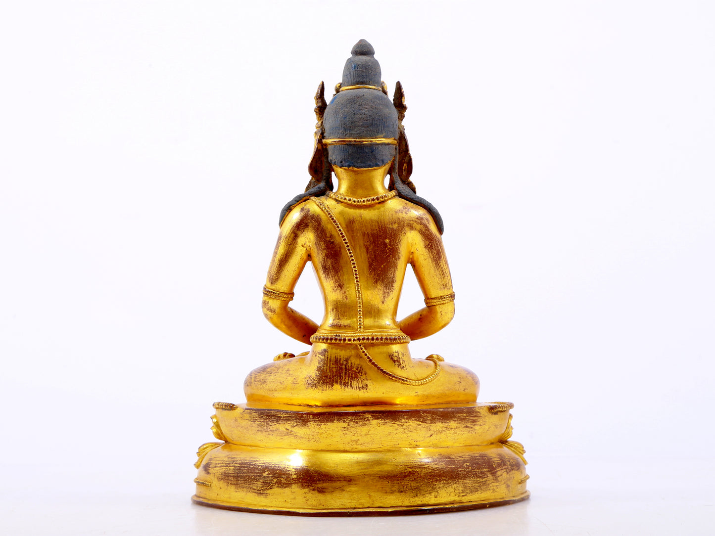 A serene gilt bronze statue of Amitayus Buddha