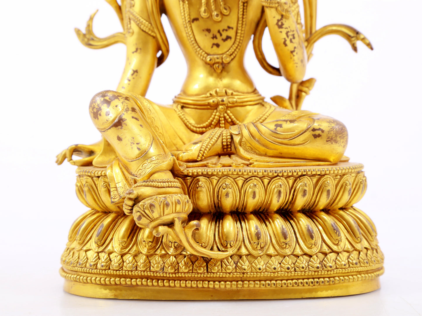 A serene gilt bronze green Tara statue