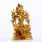 A serene gilt bronze green Tara statue