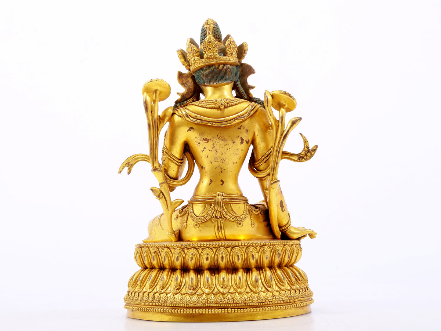 A serene gilt bronze green Tara statue