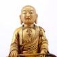 A serene gilt bronze statue of the master