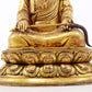 A serene gilt bronze statue of the master