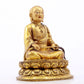 A serene gilt bronze statue of the master