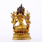 A serene gilt bronze green Tara statue