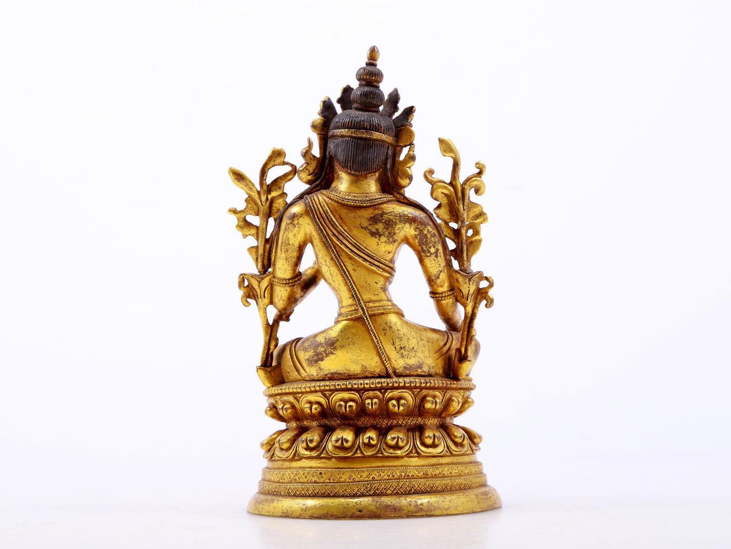 A serene gilt bronze green Tara statue