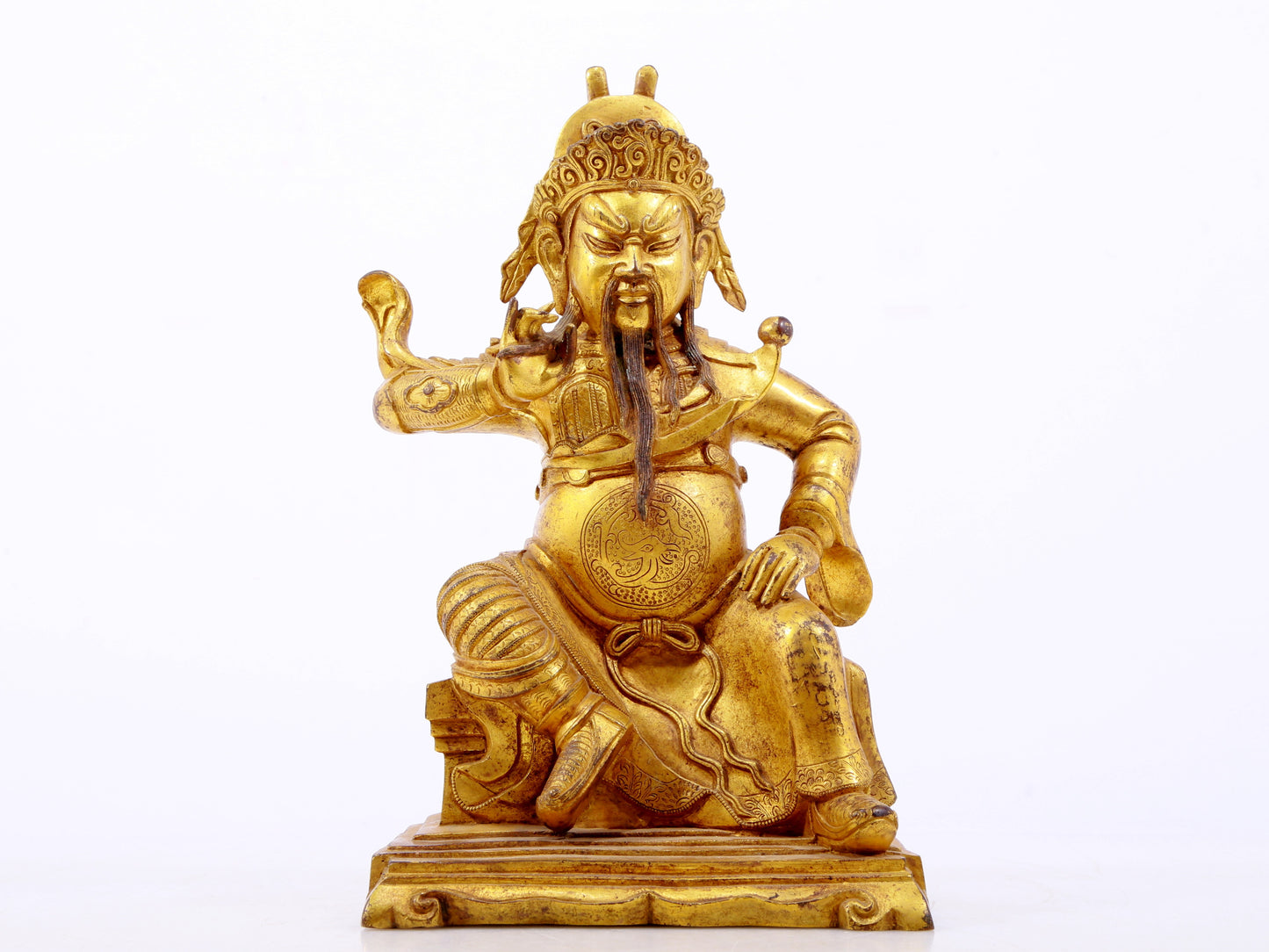 A serene gilt bronze statue of Guan Gong,