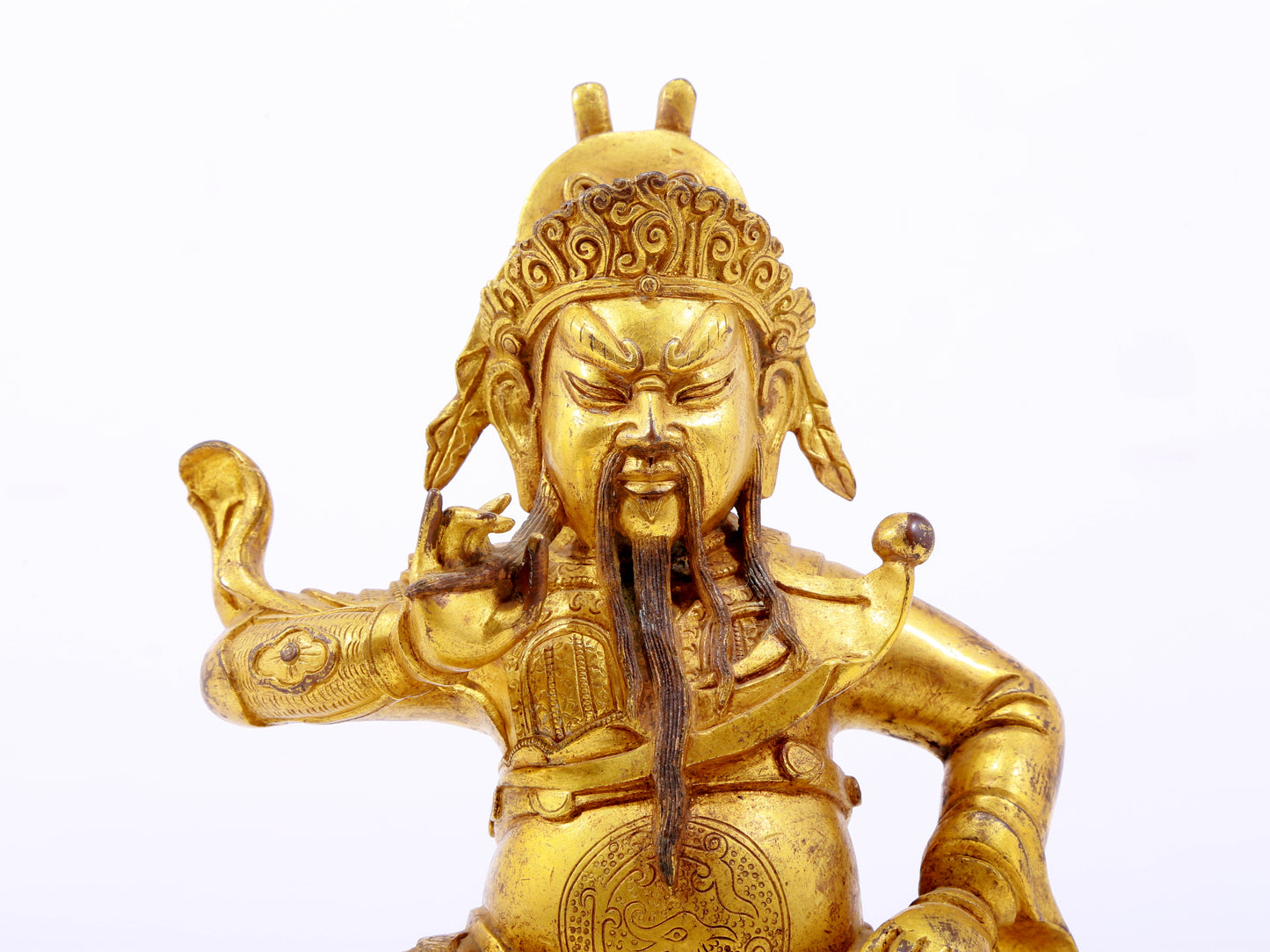 A serene gilt bronze statue of Guan Gong,