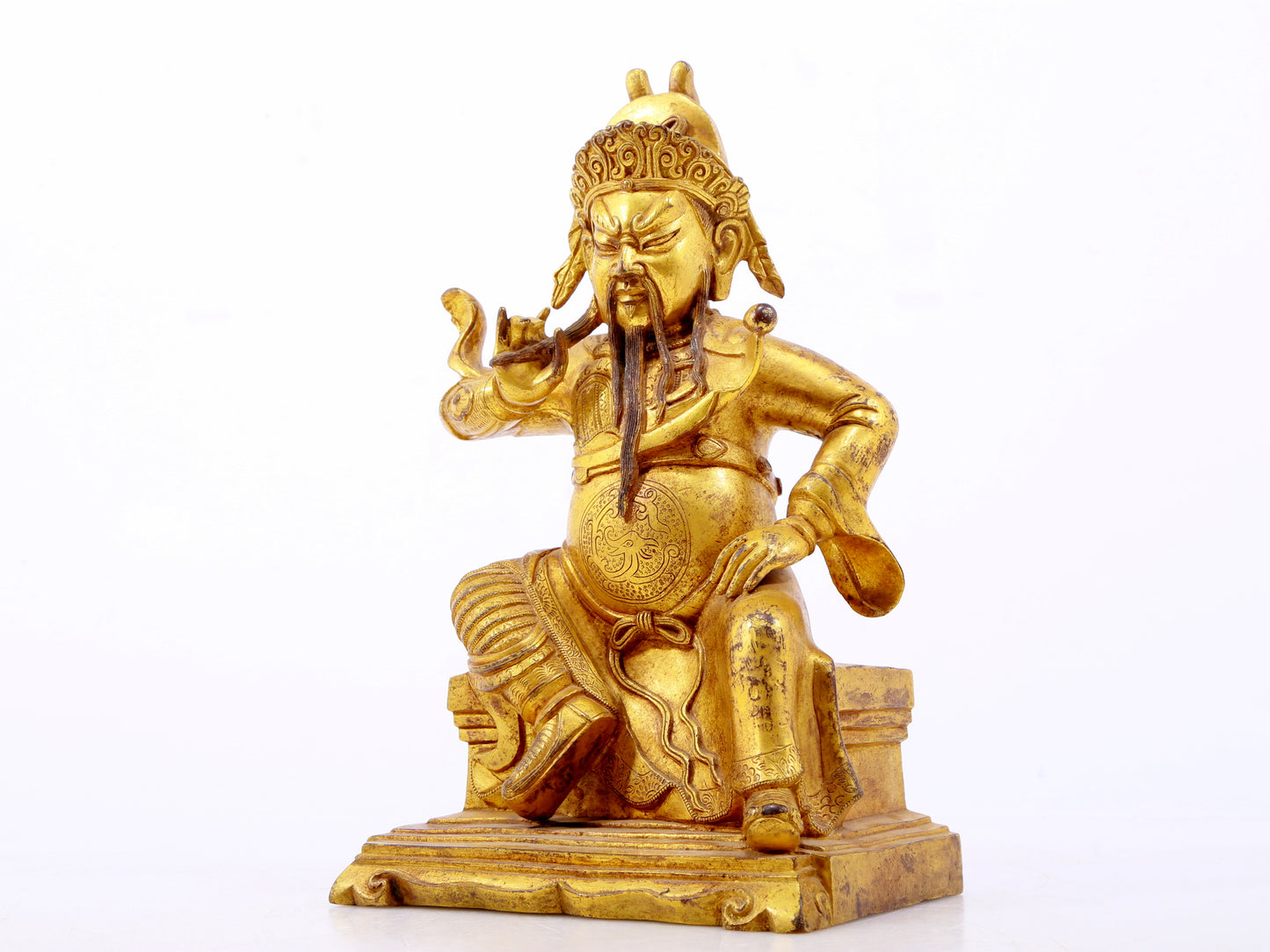 A serene gilt bronze statue of Guan Gong,