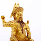 A serene gilt bronze statue of Guan Gong,