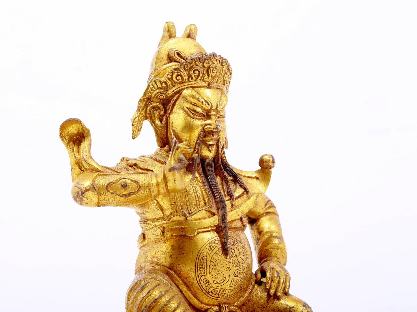 A serene gilt bronze statue of Guan Gong,