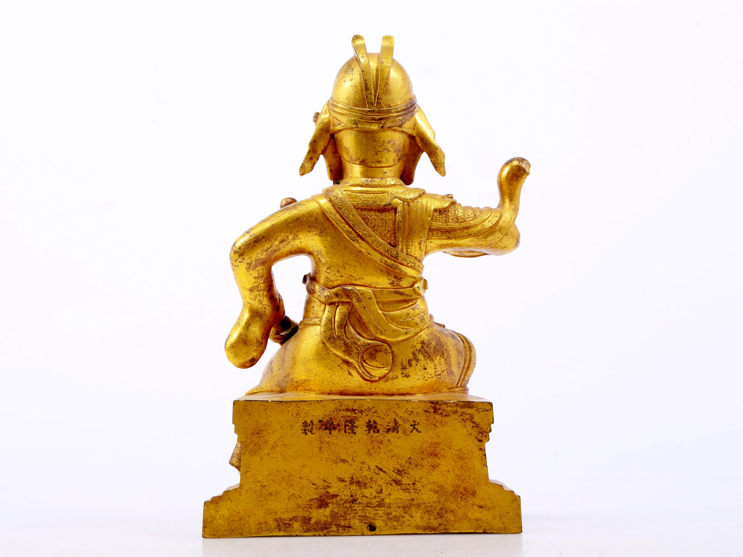 A serene gilt bronze statue of Guan Gong,