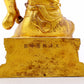 A serene gilt bronze statue of Guan Gong,