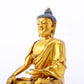 A serene gilt bronze statue of Gautama Buddha